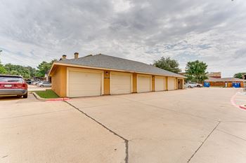 Detached garage building with multiple doors